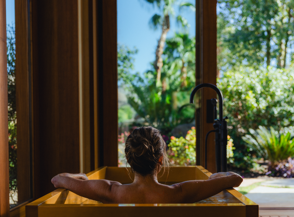 Woman sitting in a tub relaxing