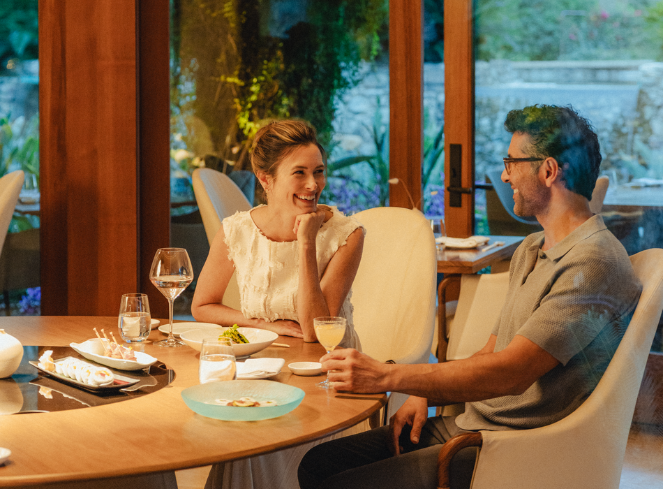 Couple having dinner and laughing